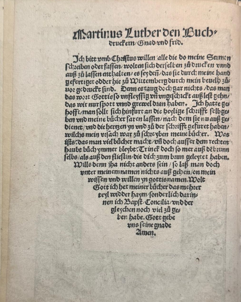 The historic printed page reproduced on slide 12, with German blackletter text tapering to an Amen