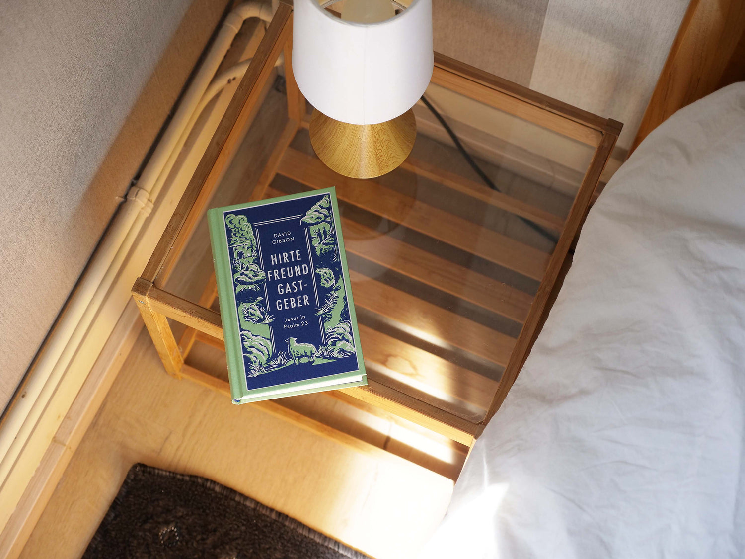 A Verbum Medien book on a bedside table